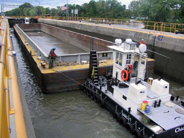 The tugboat and barge must navigate through the lock system to get to the processing facility. The barges may make as many as 20 one-way trips to and from the processing facility during a 24-hour period