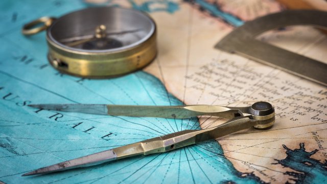 decorative image of a nautical chart and navigation tools