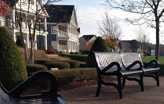 This is a picture of a redeveloped site in Oakmont, Penn that now has houses and park benches.