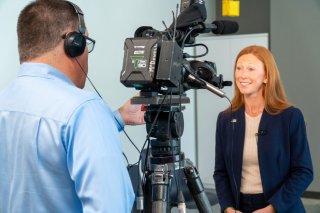 Photo of Region 7 Administrator Meg McCollister at TV interview