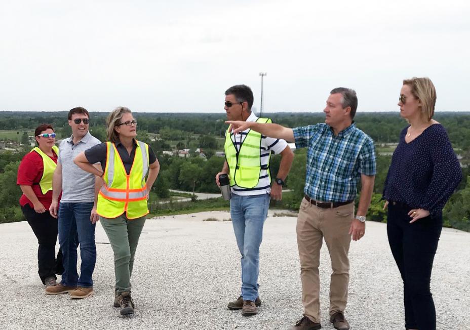 RA Idsal stands atop a chat pile while getting briefed by staff from ODEQ, the Quapaw Tribe and EPA.