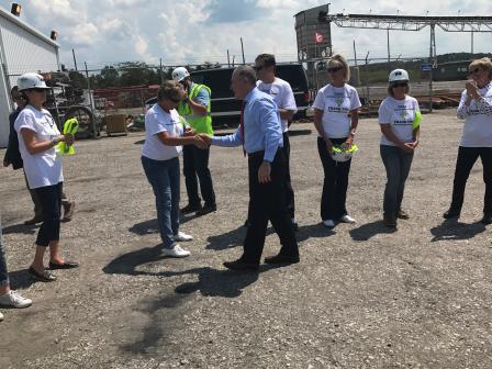 EPA Administrator Scott Pruitt shakes hands outside with a handful of employees at Liberty Mine.  