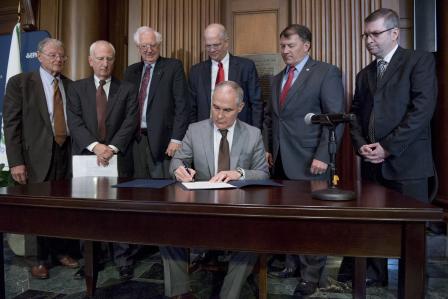 photo of epa administrator scott pruitt signing the directive and surrounded by officials
