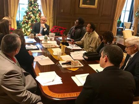 EPA Administrator Scott Pruitt and other around a large conference table.