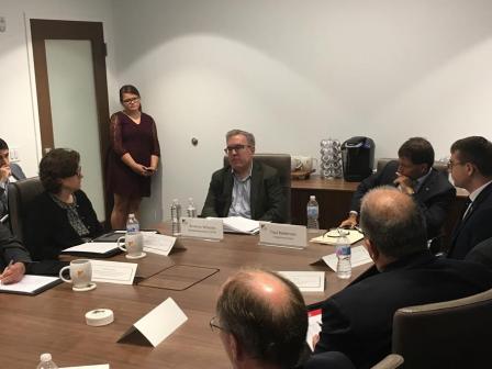 Wheeler seated at a roundtable discussion.
