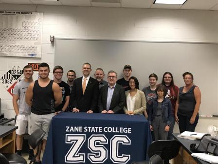 Wheeler pictured with students.