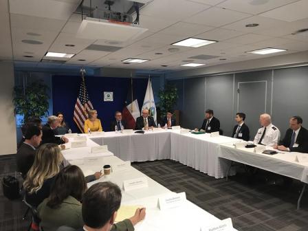 Wheeler sitting around roundtable.