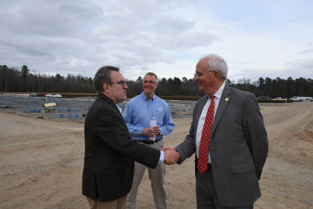 Wheeler shaking hands.