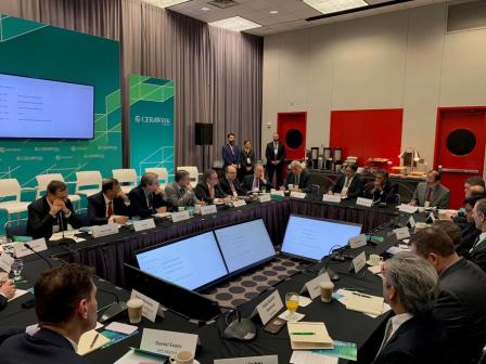 Admin sitting in roundtable discussion.