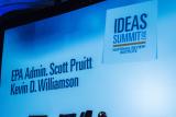 closeup of the dias backdrop, identifying Scott Pruitt as speaker