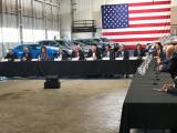 photo of President Trump, EPA Administrator Scott Pruitt, DOT Secretary Mrs. Chao, GM CEO Mary Berra, and others seated at a long table.