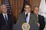 Governor Rick Perry at the podium, flanked by VP Mike Pence and EPA Administrator Scott Pruitt.
