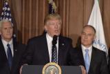 President Donald Trump at the podium, flanked by VP Mike Pence and EPA Administrator Scott Pruitt.