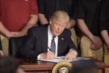 President Donald Trump signing his Executive Order directing EPA to review the Clean Power Plan.