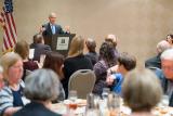 EPA Administrator Scott Pruitt stands at a lectern addressing several tables full of members of the Texas Farm Bureau.