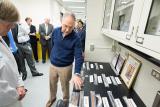 Administrator Pruitt stands near lab computers with others in the background
