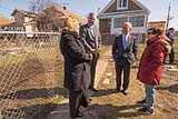 Administrator Pruitt, Governor Holcomb, and Regional Administrator Stepp stand in front of a lead-contaminated property. 