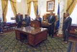 Administrator Pruitt speaks at a podium as four men look on