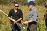 Administrator Wheeler stands with a woman in a field near Davis Pond