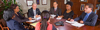 Decorative photograph showing a business meeting