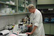 Photo of chemist preparing inorganic samples for analysis.