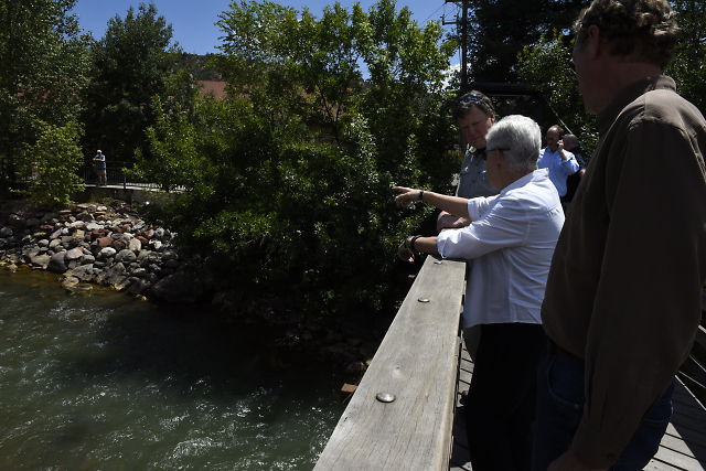 Administrator McCarthy outdoor on a bridge looking at the river.