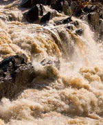 Photo showing the turbulence of an urban water flow.