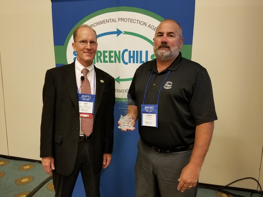 Jerry Rumple accepts Kroger’s Superior Goal Achievement recognition from Tom Land of the EPA GreenChill Program
