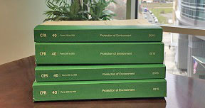 This is a picture of several regulatory books containing the hazardous waste regulations