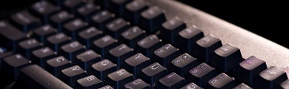 this is a very close up picture of a computer keyboard