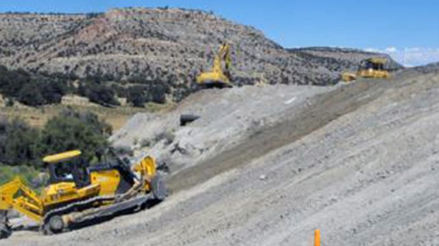 Earth mover working on a hillside