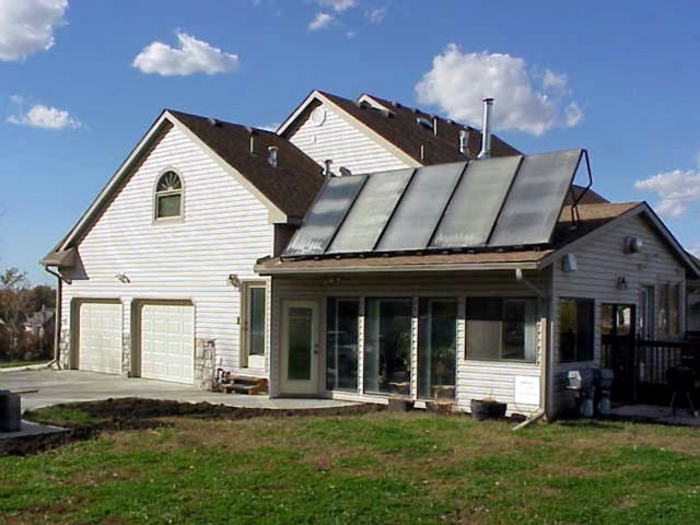 Photo: flat-plate panels on the roof of a house