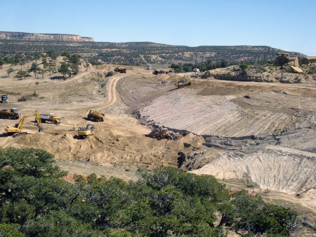 desert landscape with large construction equipment at work