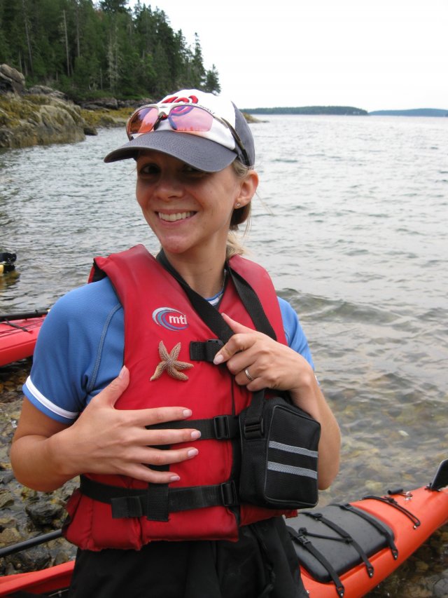 Caroline in a life jacket with a star fish