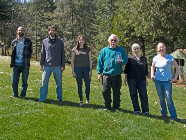 ASAT Inc. staff pose with their Tibbetts Award