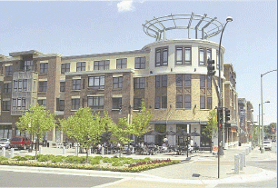 New multifamily housing building with trees in front