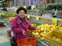 Shopper in produce section of grocery store