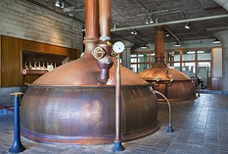 Photo: mash kettles in a brewery