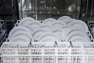 Photo: dishes in a dishwasher tray at a restaurant