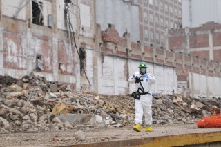 EPA On-Scene Coordinator Kevin Turner works inside the “hot zone” next to a debris pile.