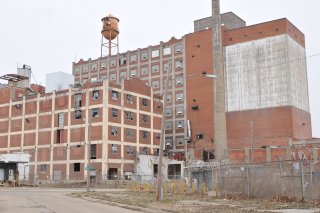 Buildings near the site entrance at the intersection of East Phillips and North 16th Streets.  