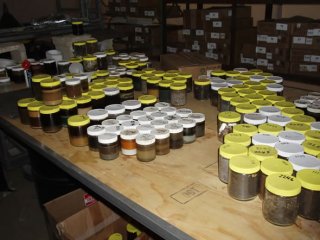 Samples from individual containers on-site.  Many of the on-site containers had multiple layers of material inside.  Materials with similar characteristics and properties are put into groups so composite samples can be collected.  This allows the on-site 