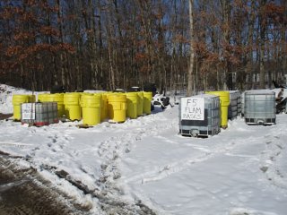 All on-site materials are grouped according to their characteristics, so those with similar properties can be transported and disposed of together.  The waste groups are segregated at the site in preparation for shipping.  This photo shows groups of flamm