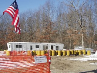 Fencing divides the property into several zones according to the site's Health and Safety Plan. This reduces possible movement of contamination from the site.