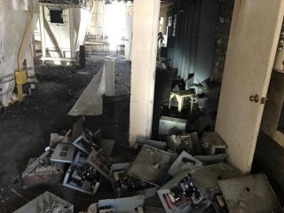 Debris scattered about inside the 4th floor of the bakery mix building.