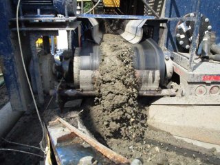 Coarse Dredged Sediment Leaving De-sanding Unit to be Conveyed to Staging Area – July 2017