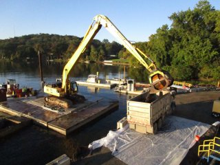 Debris with Rock Loaded into Trucks - September 2017