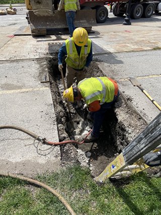Breaking and removing abandoned 4-way concrete, encased ductbank.