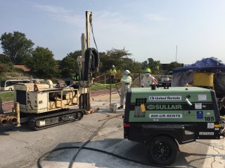 Redox Tech injecting treatment slurry in the service drive