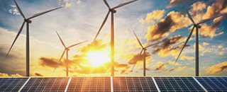 Image of solar panels and wind turbines.